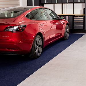 Red car parked on Blue Drip & Dry Absorbent Floor Mat