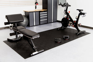 5' x 10' Midnight Black Levant texture vinyl flooring beneath workout equipment