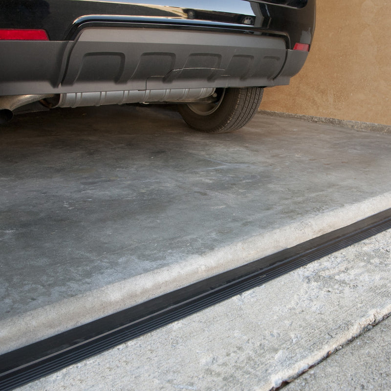 Vinyl garage threshold on concrete floor with car bumper