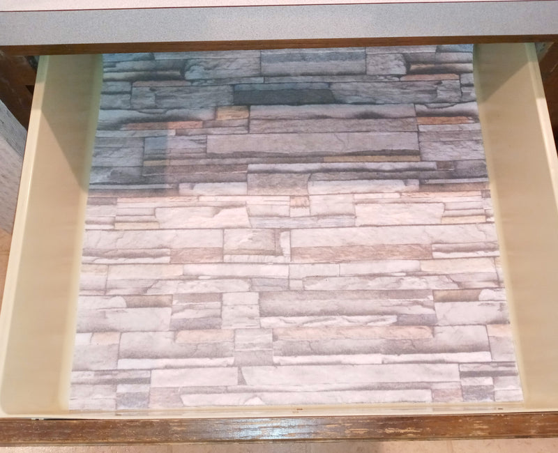 Stacked stone printed liner installed in drawer