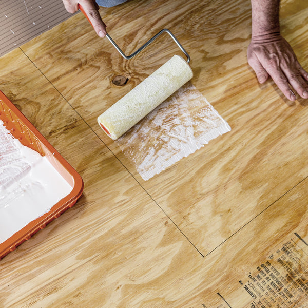 Applying adhesive to wood with paint roller