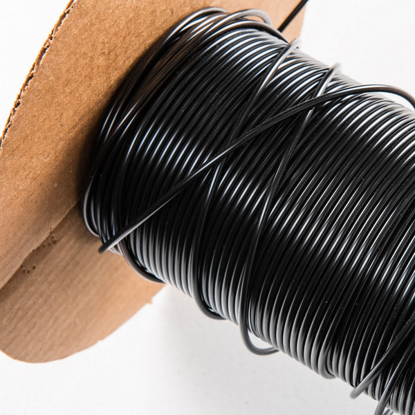 Black welding rod on spool