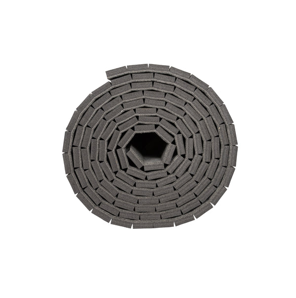 Side view of cross cut carpet bonded foam roll on white background