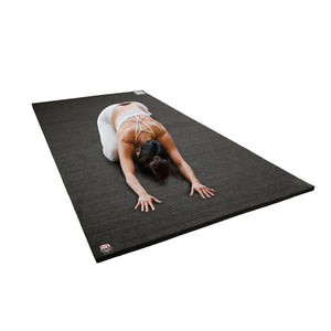 Athlete practicing tumbling on carpet bonded foam gymnastics training mat