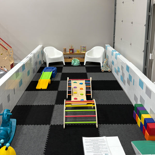 Carpet bonded foam interlocking gym tiles installed in a children's playroom training space
