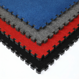 Stacked carpet bonded foam gym flooring tiles in black, red, charcoal and blue, showing foam thickness and edge