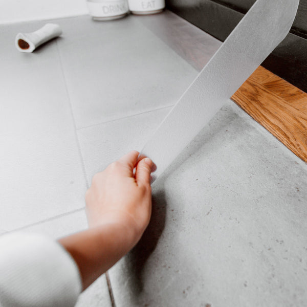 Hand lifting clear vinyl floor protector