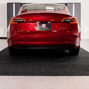 Red car parked on Grey Drip & Dry Absorbent Floor Mat