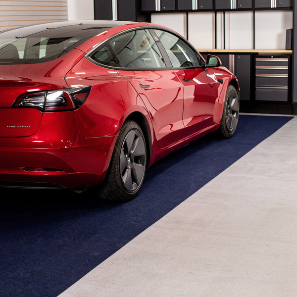 Red car parked on Blue Drip & Dry Absorbent Floor Mat