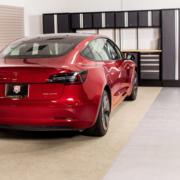 Red car parked on Tan Drip & Dry Absorbent Floor Mat