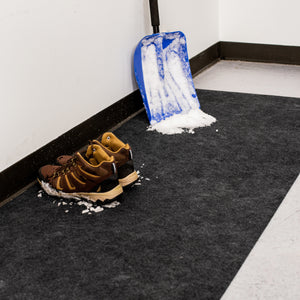 Boots and snow shovel on Grey Drip & Dry Absorbent Runner