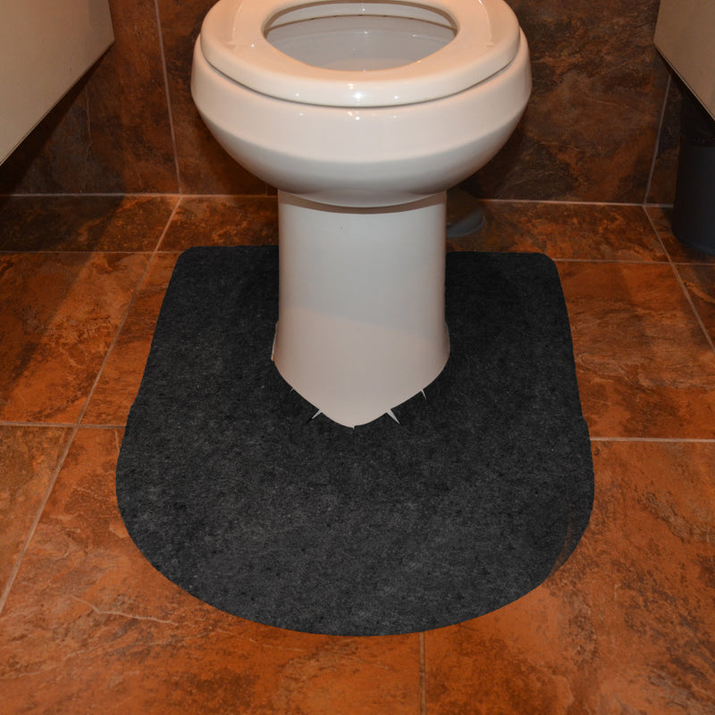 Grey Drip & Dry toilet mat at base of toilet pedestal