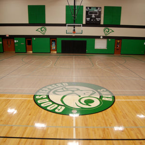 Clear vinyl activity flooring on wood basketball court