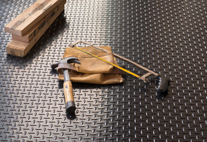 Tools on top of Midnight Black Diamond Tread vinyl flooring