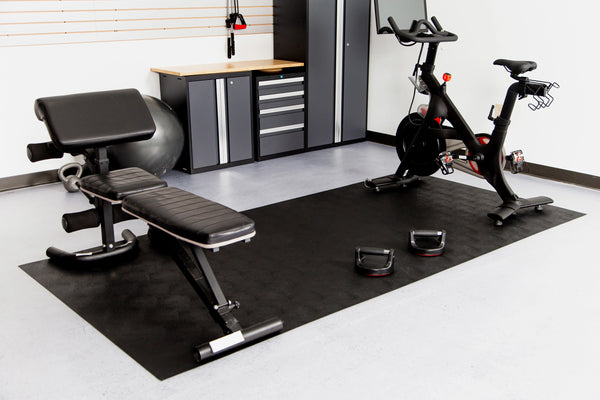 5' x 10' Midnight Black Levant texture vinyl flooring beneath workout equipment