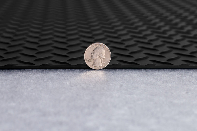 US Quarter coin in front of cross-sectioned Midnight Black Diamond Tread texture vinyl flooring