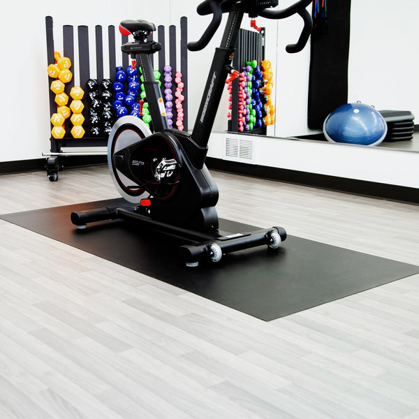 Stationary bike on Midnight Black Ceramic texture vinyl exercise equipment mat