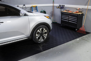 Silver car and tool chest on Midnight Black Levant texture vinyl flooring