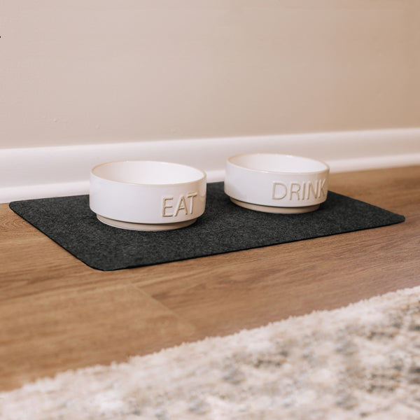 Pet food bowls on top of Grey Drip & Dry pet bowl mat