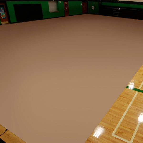 Sandstone vinyl activity floor covering on wooden gym floor