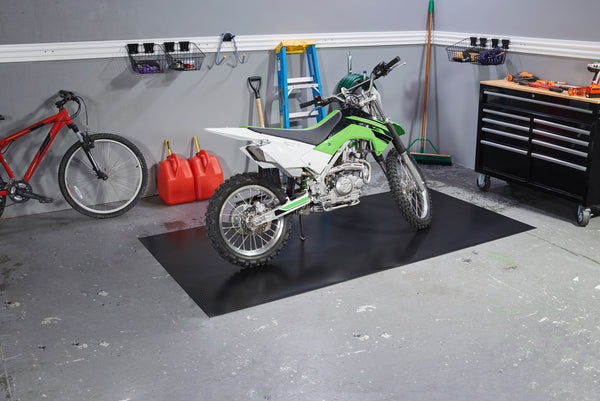Rib mat in Midnight Black shown with Motorcycle on the mat