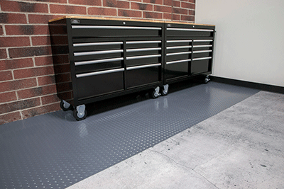Diamond Tread texture shown in slate grey with 2 tool boxes on a garage mat