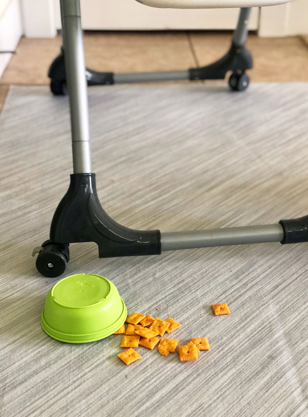 Spilled food and high chair on top of Brushed Metal pattern printed liner