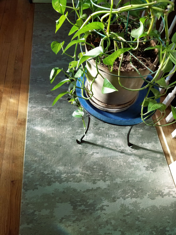 Digital Green Camo pattern printed liner beneath potted plant