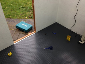 Slate Grey Diamond Tread shed flooring with tools on top