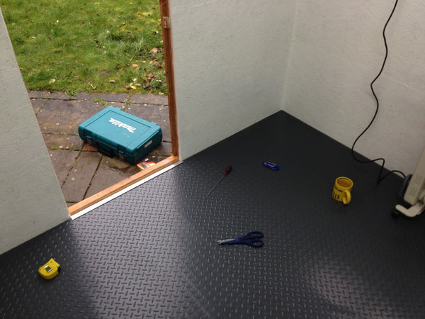 Slate Grey Diamond Tread shed flooring with tools on top