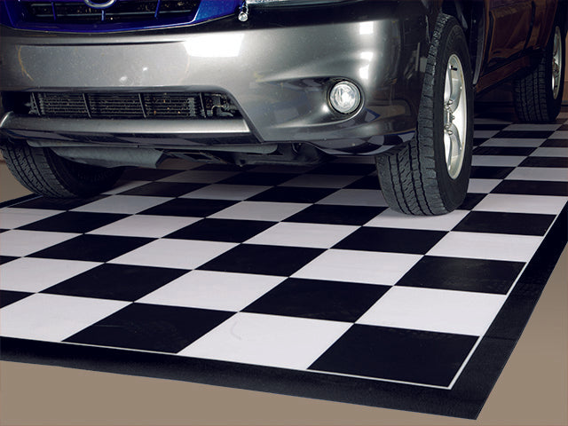 Black and white checkerboard mat with black border shown with an SUV on the mat to show an example usage