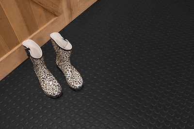 Large Coin Texture in midnight black shown with rubber rain boots for illustrative purpose