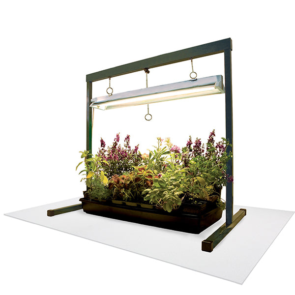 growing example with plants in a tub with white vinyl growfloor and a suspended grow light