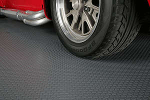 Car tire on Slate Grey Small Coin texture vinyl garage flooring