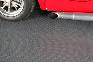 Red car on top of Slate Grey Small Coin texture garage flooring