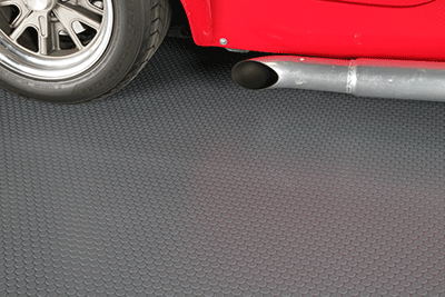 Red car on top of Slate Grey Small Coin texture garage flooring