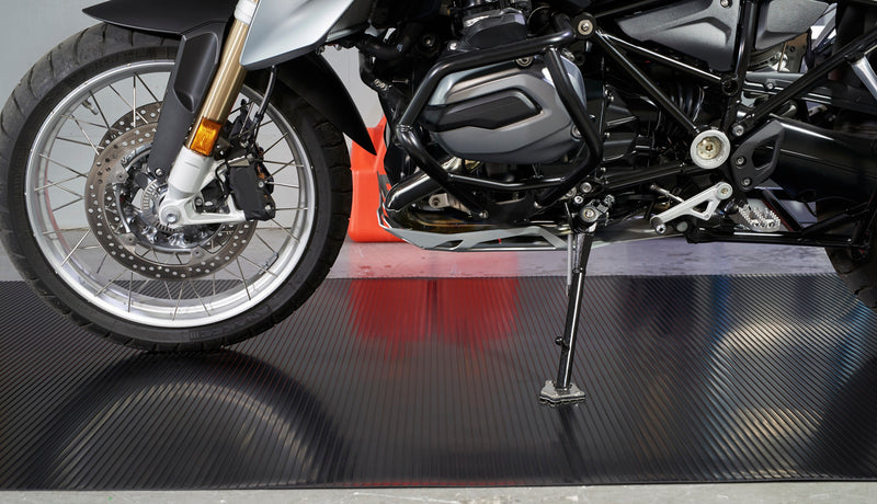 Motorcycle on top of Midnight Black Ribbed texture vinyl motorcycle mat