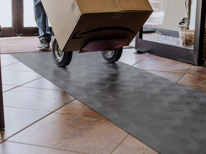 Cardboard box and dolly on Slate Grey Levant texture vinyl floor runner