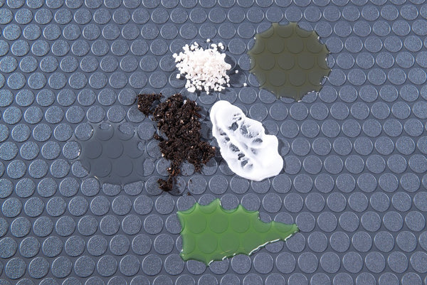 Various chemicals on Slate Grey Small Coin texture vinyl flooring