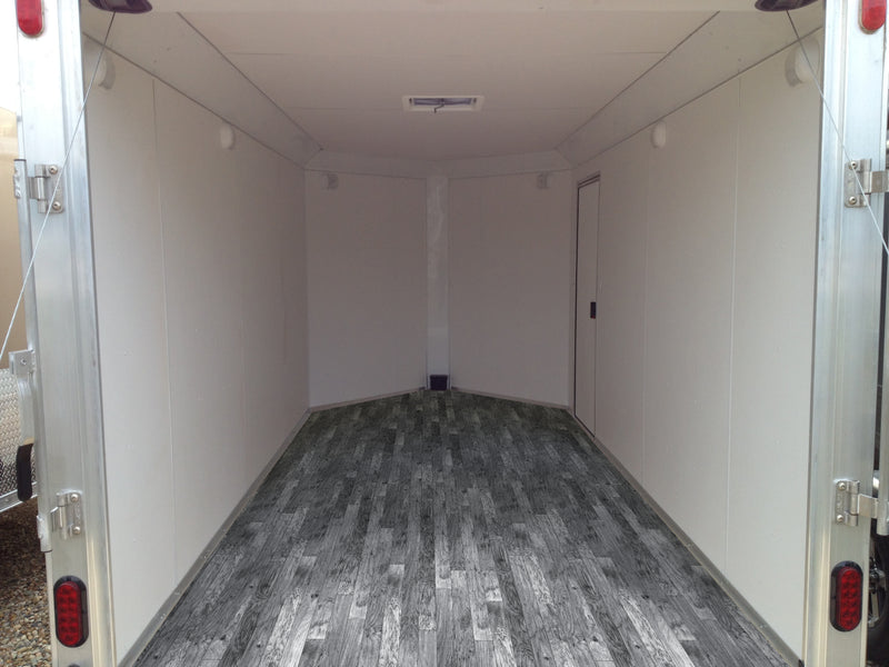 weathered oak charlotte welded vinyl flooring shown installed in a trailer
